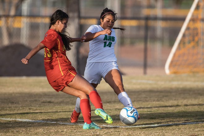 Natalie Boylston (13) kicks the ball as the Centennial Hawks face off against the Albuquerque Bulldogs at the Field of Dreams soccer complex in Las Cruces in the first round of the girls state soccer tournament on Tuesday, Oct. 26, 2021.