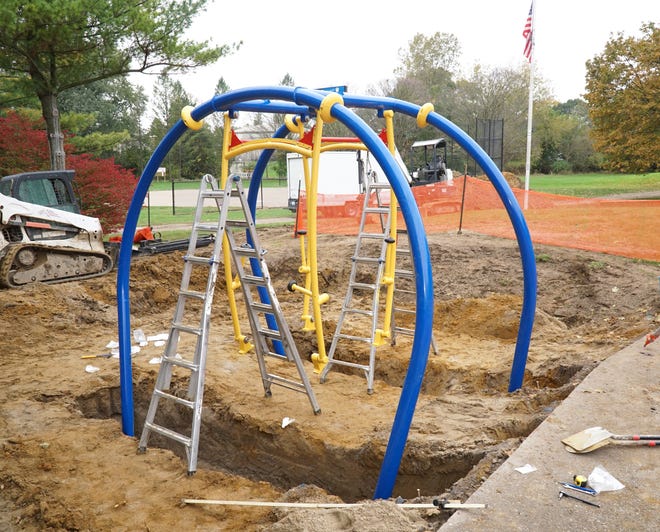                               WeSwing, a $50,000 piece of playground equipment that is accessible for children with disabilities, is in the process of being installed at South Lyon's McHattie Park on Oct. 27, 2021. 