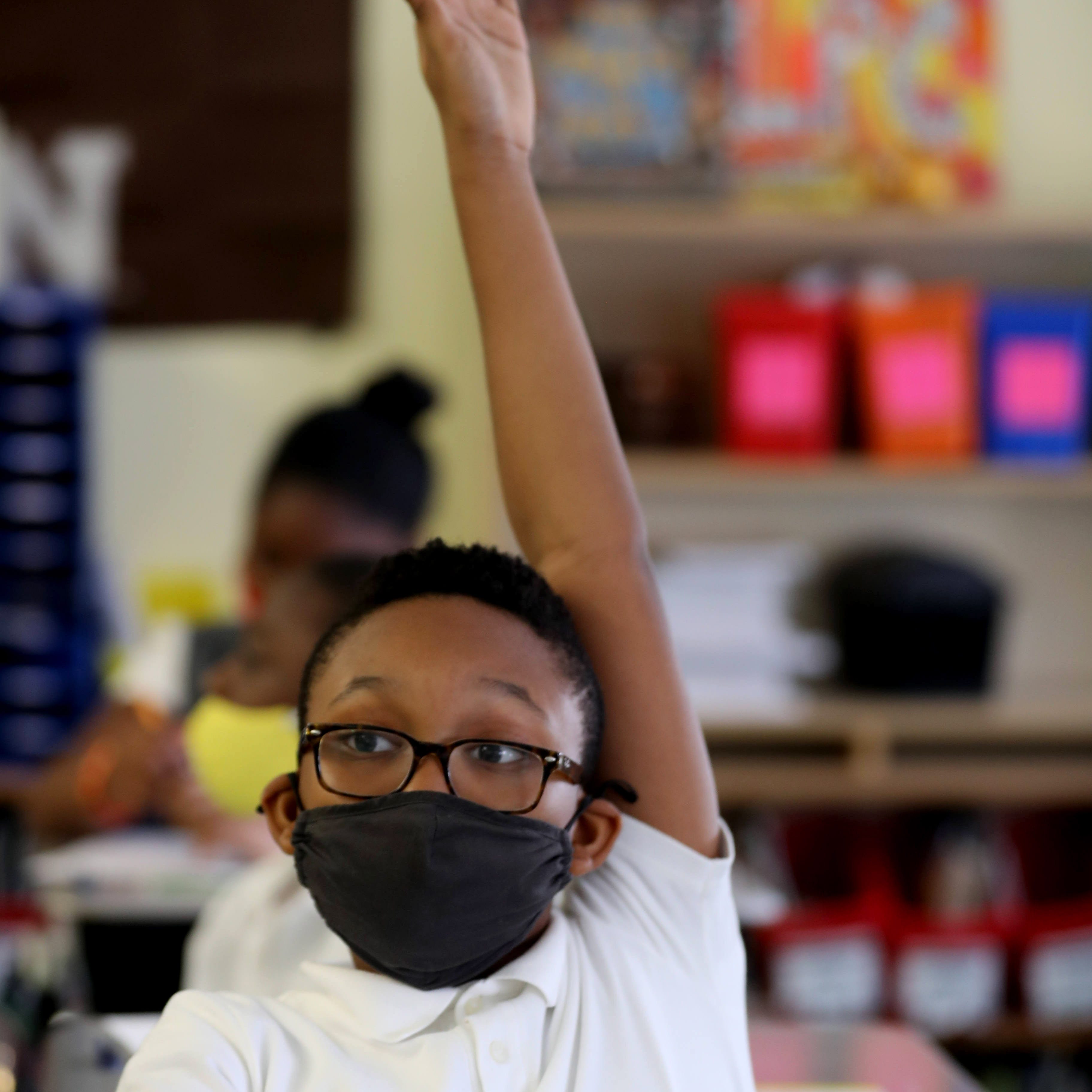 Jeremiah Mathurin, a fourth-grade student at Leadership Prep Canarsie, a magnet school in Brooklyn, N.Y., participates in class during the ninety minute math component of the school day Oct. 28, 2021. 