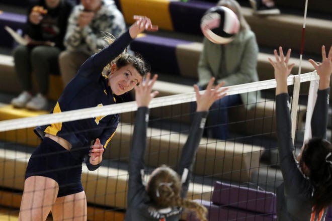 Notre Dame High School's Gabby Deery (11) spikes the ball during their Class 1A regional volleyball final against Easton Valley High School Wednesday Oct. 27, 2021 at Muscatine High School. 