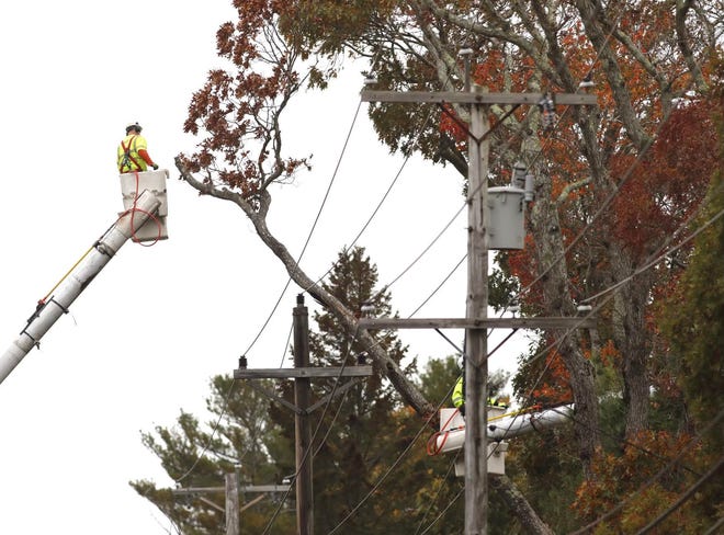 Crews work to restore power along Route 3 in Scituate.