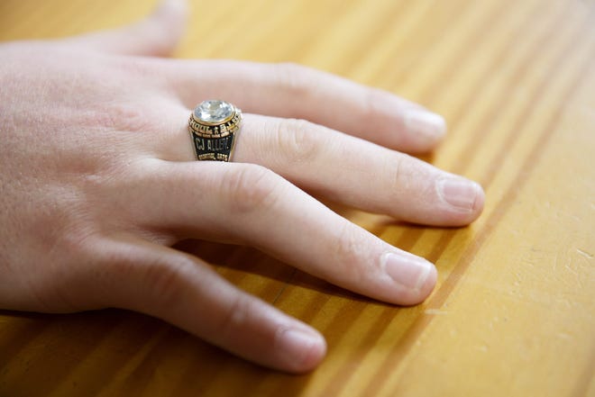 CJ Larsen, 18, wears a class ring for Roberts High School at his home in Salem on Wednesday, April 18, 2018. Larsen required special education and attended Sprague High School, then dropped out and earned his GED through the Downtown Learning Center.