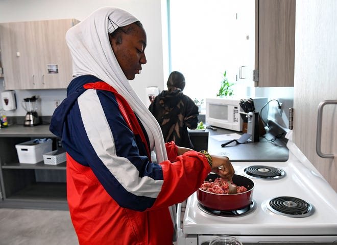 Junior Fatuma Ibrahim browns beef in the Advanced Foods class while preparing spicy goulash for families facing food insecurity on Thursday, October 28, 2021, at Jefferson High School in Sioux Falls.