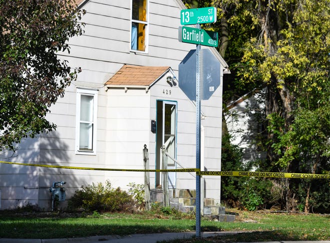 Crime scene tape surrounds the block between 12th and 13th Streets on Garfield Avenue after a police-involved shooting on Thursday, October 28, 2021, in Sioux Falls.
