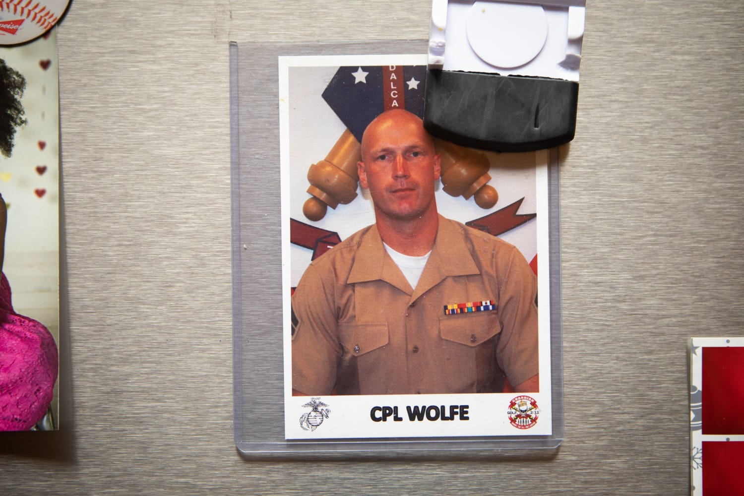 A photograph on the Wolfe family's refrigerator shows Kiowa after returning home from a tour in Afghanistan, Aug. 5, 2021.