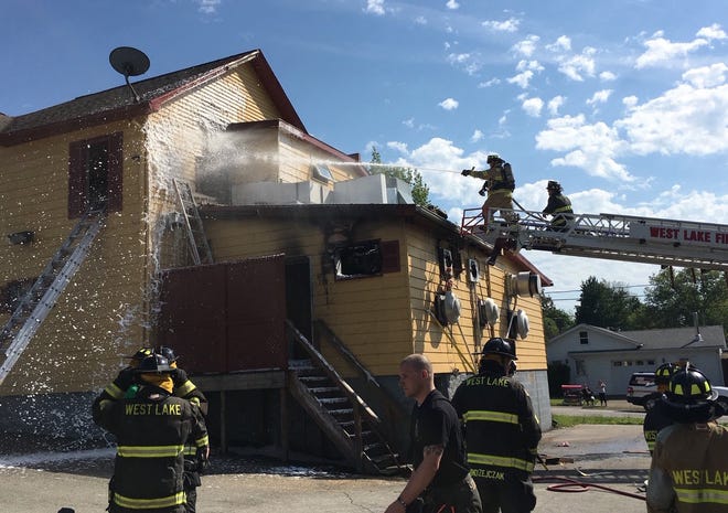 Millcreek Township fire crews douse the back area of the Royal Chop Stix restaurant in June in the 3400 block of West Lake Road. Fire heavily damaged the kitchen and a second-floor apartment. There were no injuries.