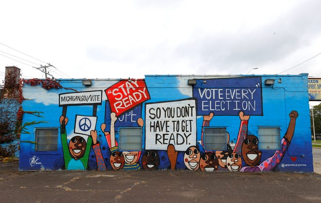 A mural about voting on the side of a building on Livernois near 7 Mile Road in Detroit on Saturday, Oct. 23, 2021.