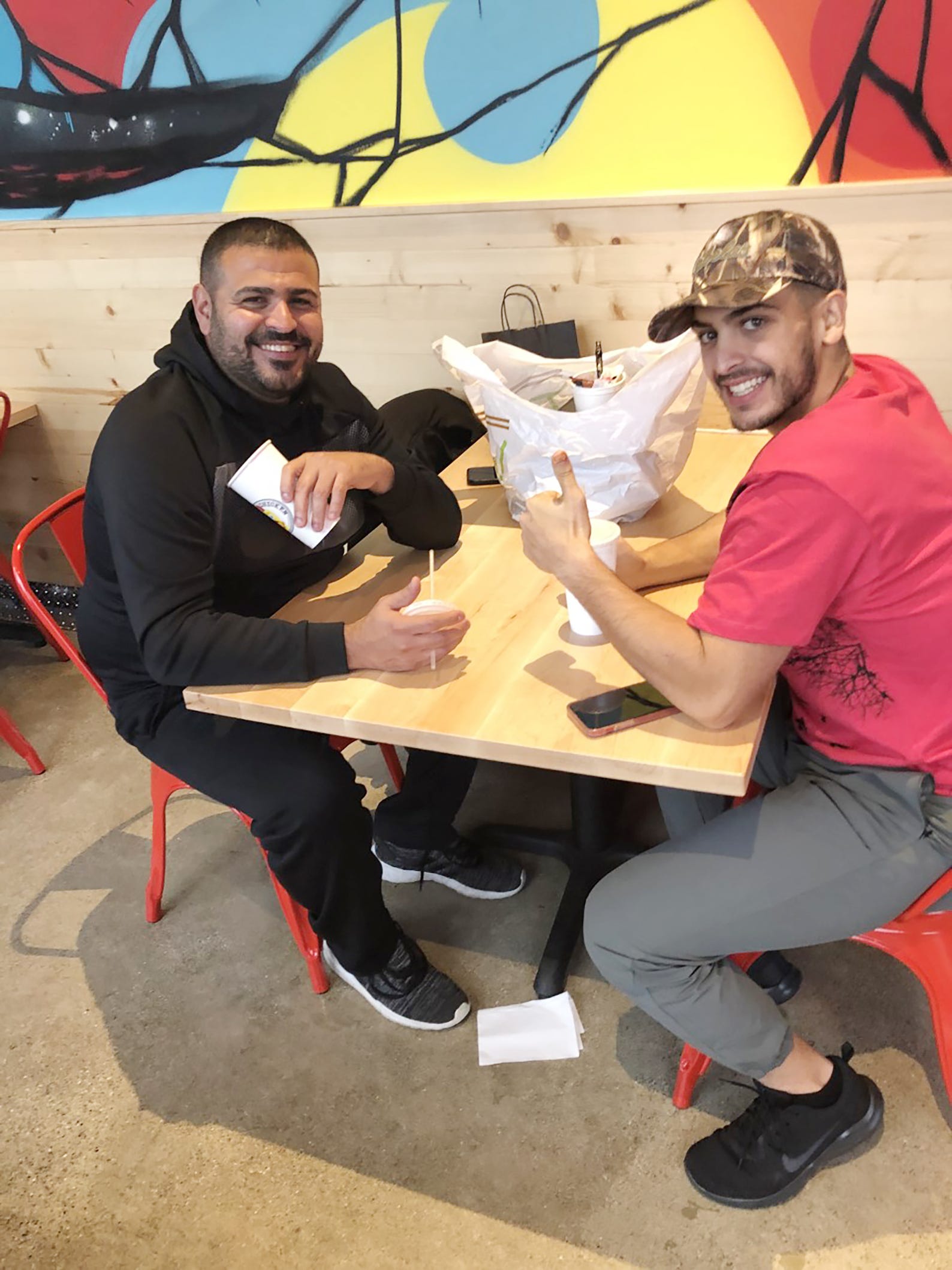 Fadi Naji (L) and Hussein Naji (R) enjoyed the chicken at the new Dave's Hot Chicken in Dearborn.