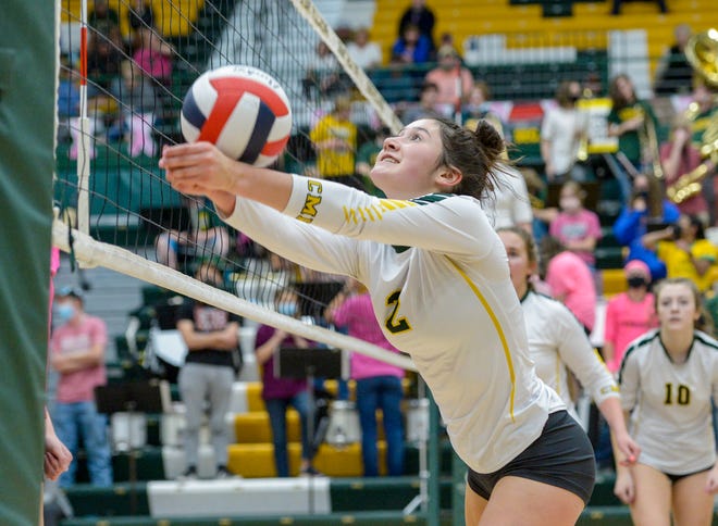 CMR's Lauren Lindseth saves a point at the net during the crosstown volleyball match against Great Falls High last month at the CMR Fieldhouse.