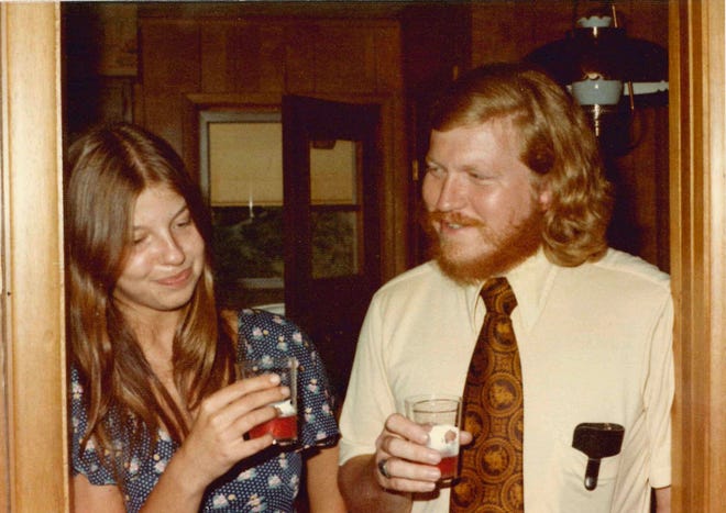 Karl Edward Wagner and Barbara Mott at a family gathering in the 1970s share a joke.