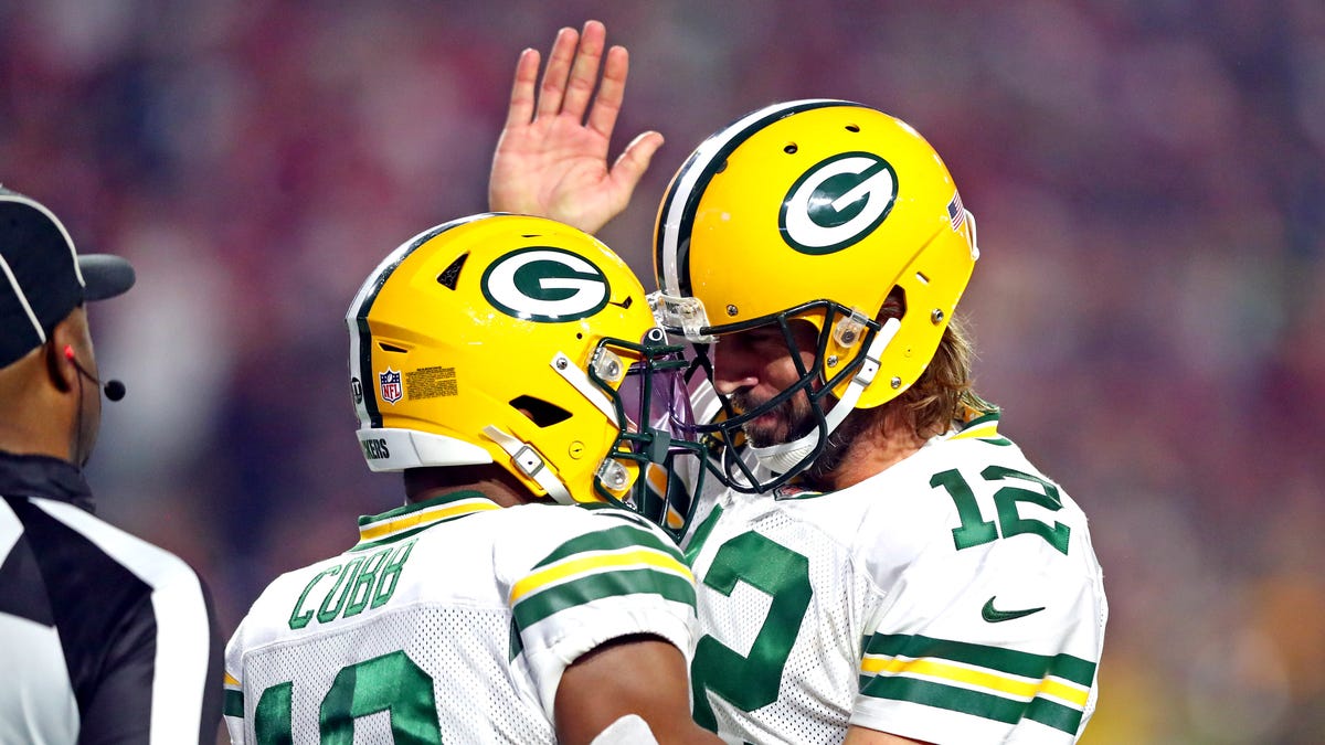 Green Bay Packers wide receiver Randall Cobb celebrates with quarterback Aaron Rodgers after catching a touchdown pass in the second half.