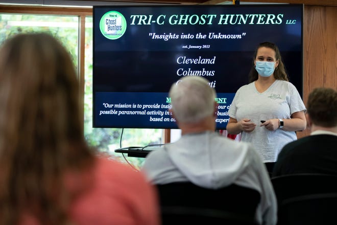Lisa Rorris, a lead investigator with the Tri-C Ghosthunters, gives a presentation of the group's paranormal experiences at the Pickerington Public Library Saturday.