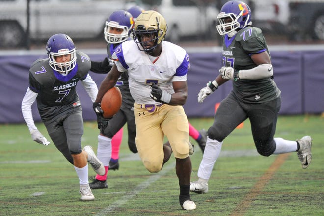 Moses Meus and the St. Raphael football team host Moses Brown at Pariseau Field in Pawtucket for their Thanksgiving Eve game on Wednesday night.