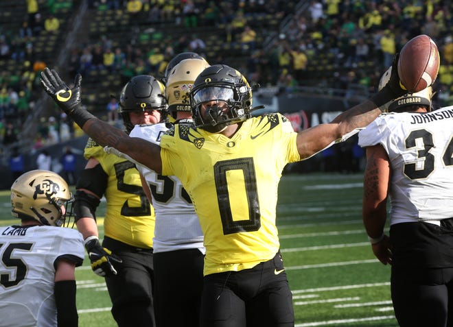 Oregon's Seven McGee celebrates his fourth quarter touchdown against Colorado on Saturday.