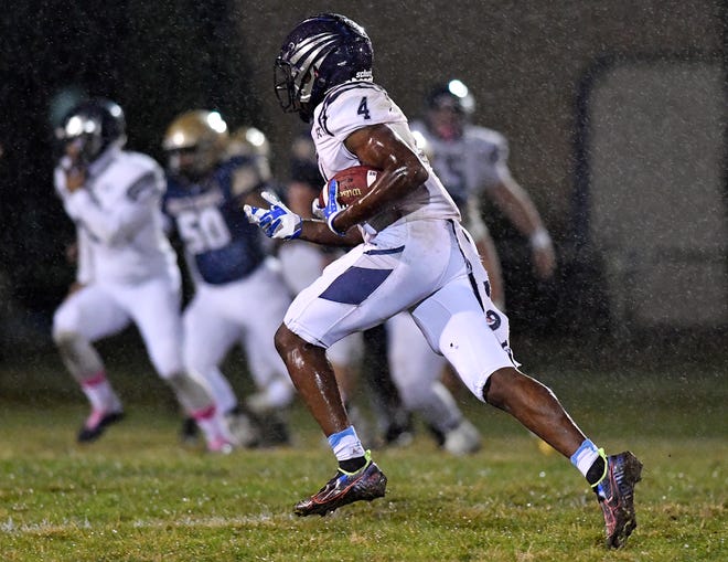 St. Augustine's Nasir Hill (4) runs for a gain during Friday nights football game against Holy Spirit. The visiting Hermits topped Holy Spirit 35-21 in Absecon. Oct. 29, 2021.