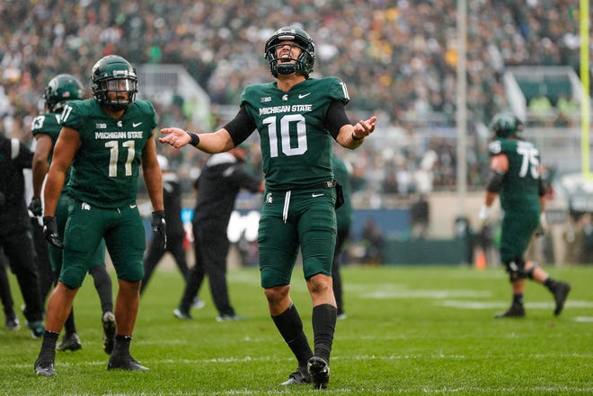 Michigan State quarterback Payton Thorne (10) celebrate a touchdown against Michigan during the second half at Spartan Stadium in East Lansing on Saturday, Oct. 30, 2021.