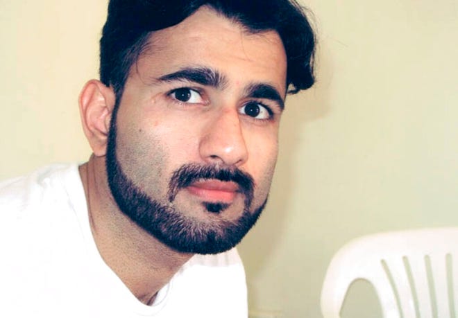 This 2018 photo provided by the Center for Constitutional Rights shows Majid Khan. A military jury imposed a sentence of 26 years Friday, Oct. 29, 2021, on Khan, a former Maryland man who admitted joining al-Qaida and has been held at the Guantanamo Bay detention center. But under a plea deal, the man could be released as soon as next year because of his cooperation with U.S. authorities. (Center for Constitutional Rights via AP)