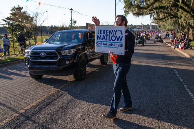 City Commissioner Jeremy Matlow waves to the crowd during the Florida A&M University homecoming parade Saturday, Oct. 30, 2021. 