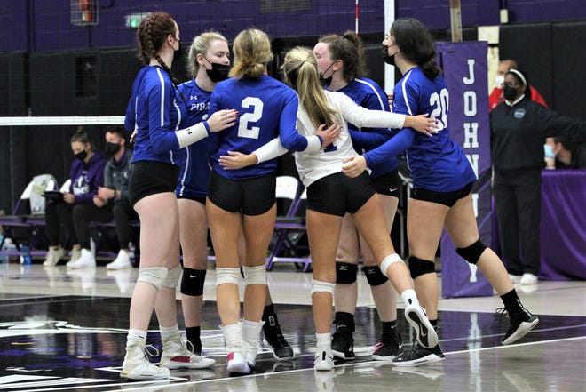 Pearl River celebrates and huddles after scoring a point during a Section 1 Class A opening round match at John Jay High School on Oct. 30, 2021. The Pirates defeated the Wolves in a five-set marathon.