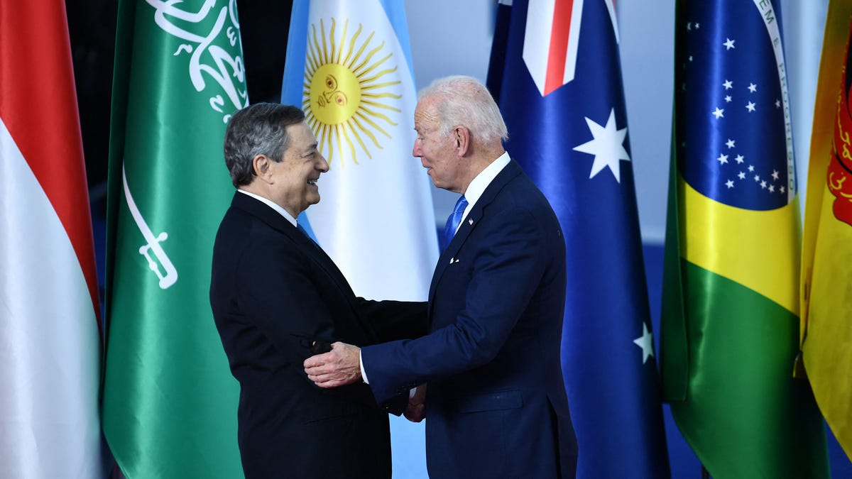 Italian Prime Minister Mario Draghi greets President Joe Biden as he arrives for the G-20 Summit of world leaders in Rome.