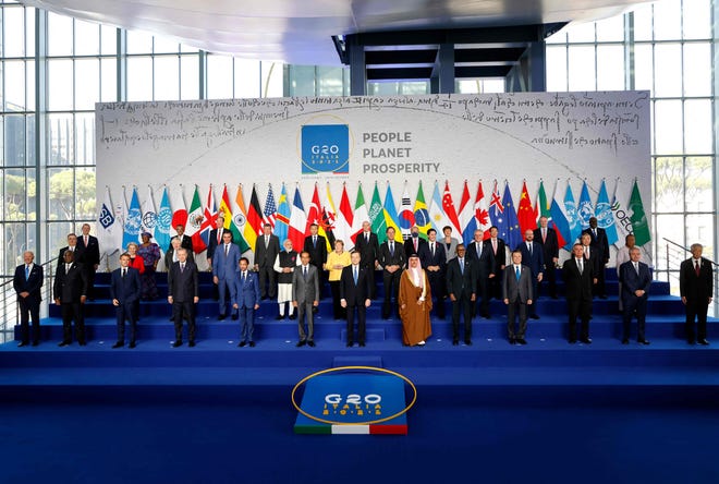 President Joe Biden and other world leaders gather for the official "family photograph" on day one of the G-20 Summit in Rome.