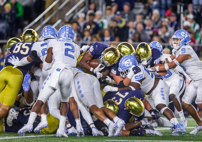 Notre Dame’s Logan Diggs (22) leaps into the end zone for a touchdown during Notre Dame's 44-34 win over North Carolina on Saturday, Oct. 30, 2021, at Notre Dame Stadium.