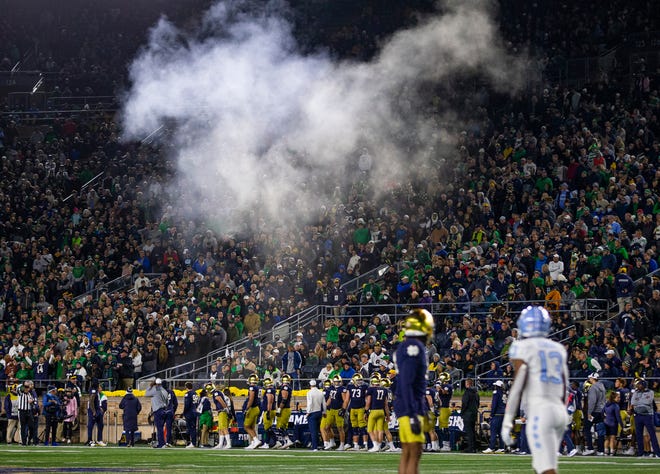 Smoke erupts from a heater near Notre Dame’s team bench during ND's 44-34 win over North Carolina on Saturday, Oct. 30, 2021, at Notre Dame Stadium.