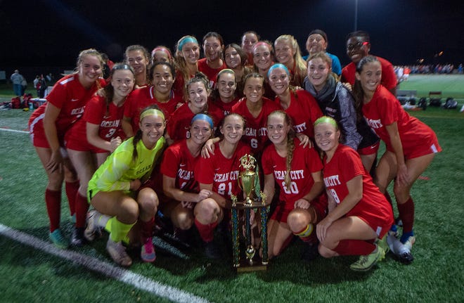 Ocean City High School girls soccer team celebrates winning the Coaches Tournament, held at DeCou Soccer Complex in Cherry Hill, on Saturday, Oct. 30, 2021.