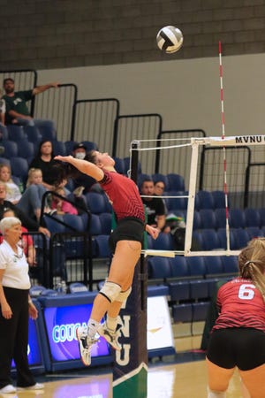 Cardington's Audrey Brininger goes up for a kill against Northridge during the Division III district championship volleyball match at Mount Vernon Nazarene's Ariel Arena last fall. She became the first in program history to reach 1,000 kills for her career.