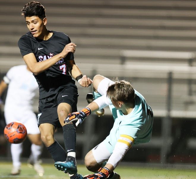 South Salem's Julian Rivas Delgado (7) and Centennial's Dennis Bessarab (1) collide during the second half of the state playoff match at South Salem High School in Salem, Ore. on Saturday, Oct. 30, 2021.