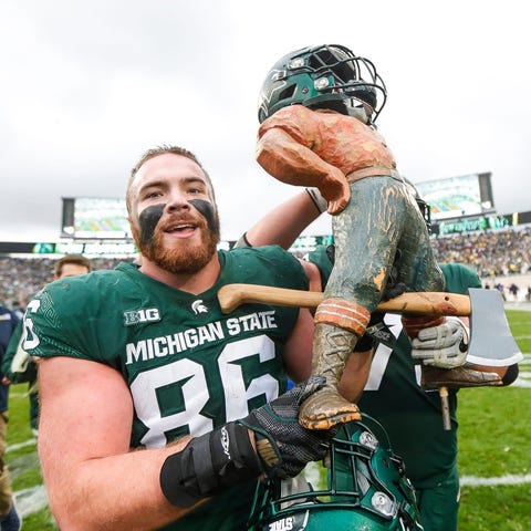 Michigan State defensive end Drew Beesley carries 