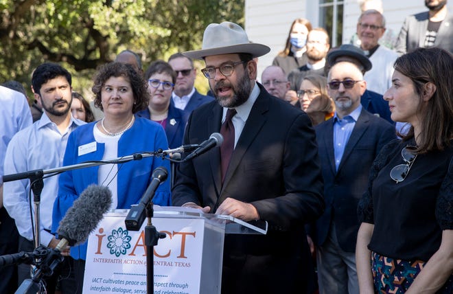 Rabbi Neil Blumofe of Congregation Agudas Achim speaks at a news conference where dozens of faith leaders and elected officials gathered to show their support of the Jewish community in a time of recent antisemitic acts.