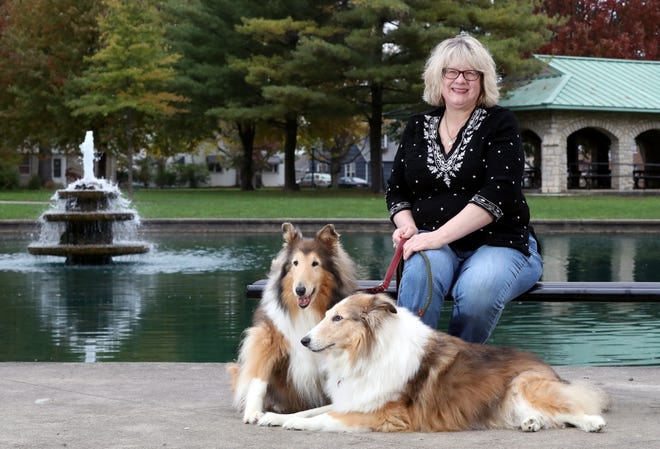 Stacey Gallant of west Columbus sits with her rough-coat collies Lark (left), 13, and Jiminy, 10, at Westgate Park on Oct. 2. Lark and Jiminy were adopted from Union County Humane Society and Dublin-based Almost Home Dog Rescue of Ohio, respectively.
