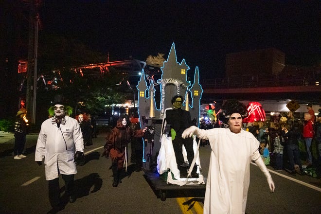 Marchers participate in the 26th Portsmouth Halloween Parade Sunday, Oct. 31, 2021.