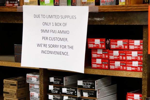 Signs point out quantity limits on certain types of ammunition after Dukes Sport Shop reopened, Wednesday, March 25, 2020, in New Castle, Pa. under the new conditions specified for gun stores. The store had closed last week when Pennsylvania Gov. Tom Wolf ordered a shut down of non-essential businesses to slow the spread of the coronavirus.