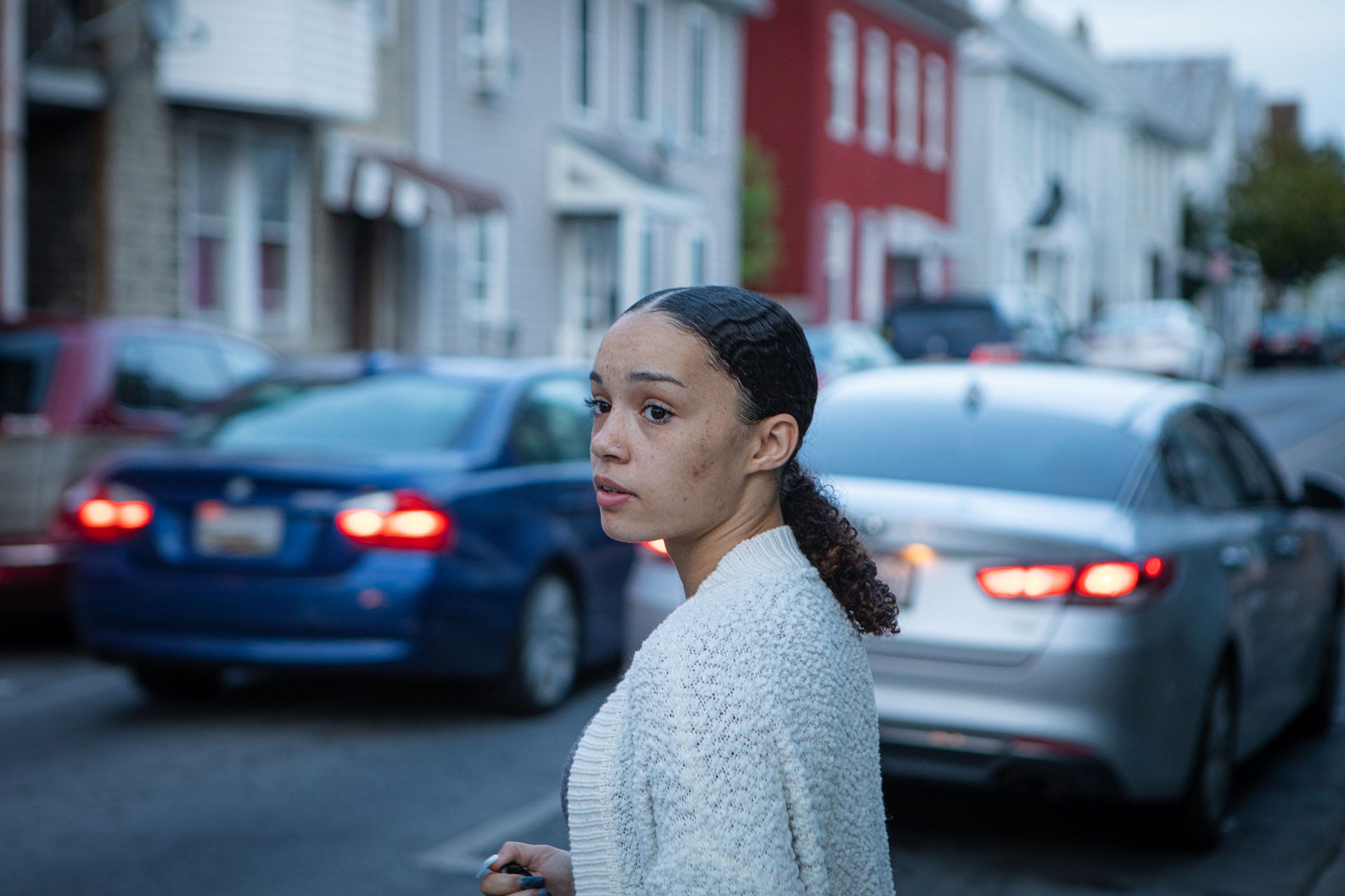 Brianna Stuart stood in front of the buildings where she encountered the police in 2016 as a 15-year-old, in Hagerstown, Md., on Oct. 8, 2021.
