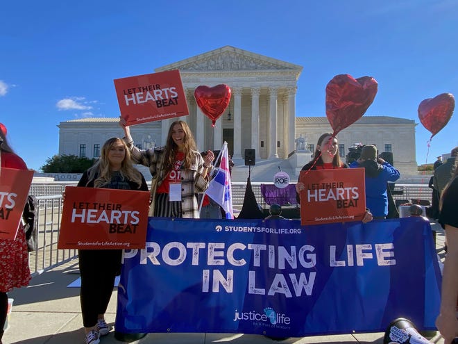 Protesters are gathering outside the Supreme Court on Nov. 1 as the Supreme Court prepares to hear arguments related to a controversial abortion law in Texas.
