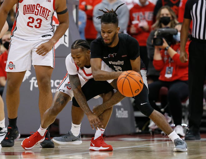 Ohio State Buckeyes guard Cedric Russell (2) defends Indianapolis Greyhounds guard Josiah Tynes (2) during the second half of the NCAA exhibition basketball game at Value City Arena in Columbus on Monday, Nov. 1, 2021. 