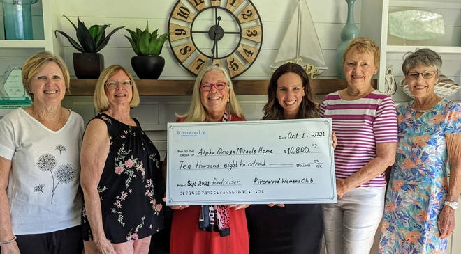 Representatives from Riverwood Women's Club presented a check for $10,800 to Alpha-Omega Miracle Home in St. Augustine. Presenting the check were club treasurer  Kathy Dittrich (from left), secretary June Herron, president Hope Terrell, Alpha Omega event specialist Audra Young, and RWC outreach committee co-chairs Linda Ommerborn and Linda Fralick.