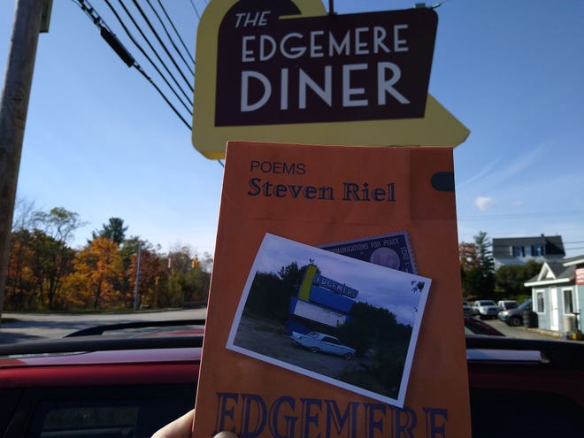 A copy of Steven Riel's poetry collection, "Edgemere," outside the soon-to-be-auctioned Edgemere Diner in Shrewsbury.