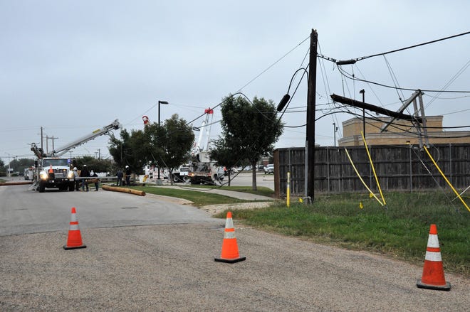 The top of a power pole in the 3400 block of Mabray Lane near the Hendrick Emergency Care Center Plaza was snapped and others nearby damaged after a city trash truck hit a power pole Tuesday.