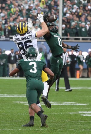 Michigan State Spartans cornerback Charles Brantley intercepts a pass to Michigan Wolverines tight end Luke Schoonmaker with one minute remaining to seal MSU's 37-33 win Saturday, Oct. 30, 2021 at Spartan Stadium in East Lansing.