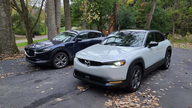The 2022 Mazda MX-30 (right) is built on the same platform as the gas-powered CX-30 (left). The CX-30 costs about $9,000 more.