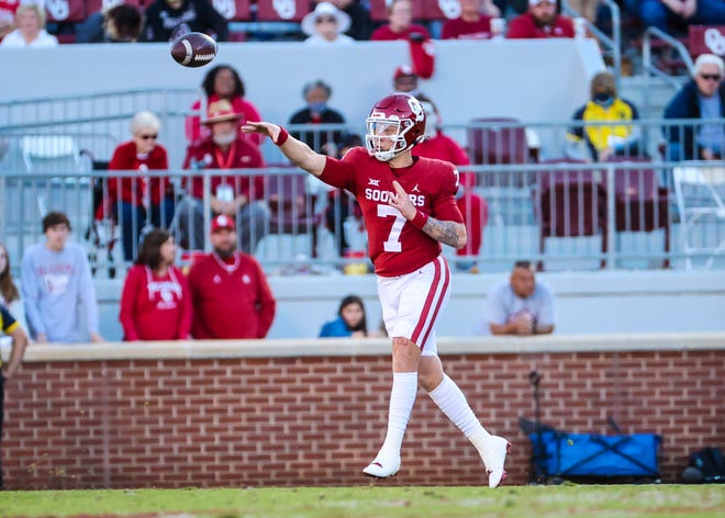 Oct 30, 2021; Norman, Oklahoma, USA;  Oklahoma Sooners quarterback Spencer Rattler (7) throws during the second half against the Texas Tech Red Raiders at Gaylord Family-Oklahoma Memorial Stadium.