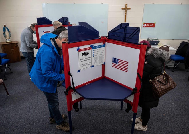 Voters fill out their ballots at a church being used as a polling station on election day in Arlington, Virginia on November 2, 2021. With the eyes of America watching, Virginians cast their ballots Tuesday as the state chooses its next governor in a margin-of-error skirmish seen as the first major test of President Joe Biden's political brand.