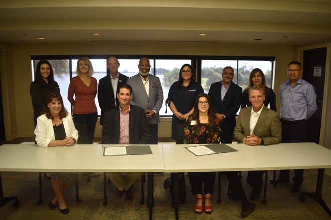At a signing ceremony on Oct. 19, representatives of the Daytona Regional Chamber of Commerce and the Urban Chamber of Commerce of Volusia/ Flagler Counties joined together to sign a memorandum of support.