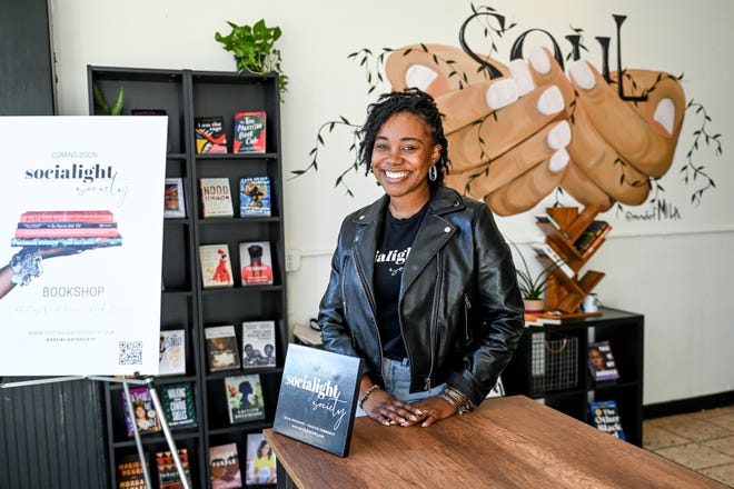 Nyshell Lawrence photographed on Wednesday, Nov. 3, 2021, at Soul Nutrition in downtown Lansing. Lawrence is opening the Socialight Society bookstore where Black women can read and discuss Black literature together.
