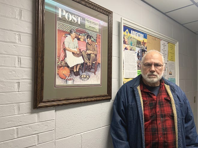 Vietnam veteran Gordon Haskins stands beside a reproduction of the Norman Rockwell painting “Home for Thanksgiving” at American Legion Post 193 in Winchendon. The original painting owned by the Post 193 is scheduled to be auctioned off on Friday.