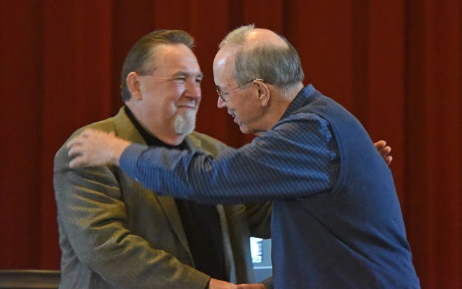 Former Ohio State Reformatory inmate Michael Humphrey, left, and former Gov. Bob Taft hug after meeting for the first time Thursday afternoon. Taft pardoned Humphrey on May 28, 2004.