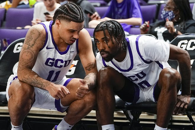 Antelopes Guard Holland Woods II (11), left, talk with Antelopes Guard Jovan Blacksher Jr. (10), right, during the second half against Western New Mexico University at Grand Canyon University Arena on Saturday, Oct. 30, 2021, in Phoenix.